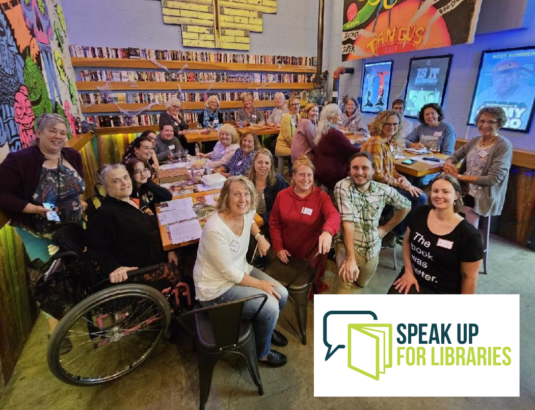 Group of women in the library - sitting, standing, in a wheelchair